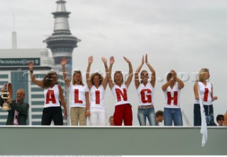 Support from Switzerlands Alinghi Challenge line up to show off there support during day four of the Americas Cup in Auckland, New Zealand. Feb, 20. 2002. Alinghi Challenge leads 3-0 over Team New Zealand. (Mandatory credit: © Sergio Dionisio/Oceanfashion Pictures)