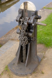 Paddle gear for opening ground paddle,Frankton top lock,Frankton Junction,Montgomery canal,Welsh Frankton,Shropshire,England,UK.April 2006.To control traffic,these locks are closed apart from specified times each day,hence the chain and padlock.