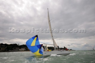 dropping spinnaker on racing yacht sailing Cowes Week Isle of Wight
