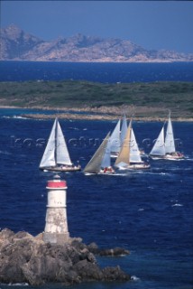 Fleet of Swan yachts racing through the Maddalena Islands off Port Cervo Sardinia during the Rolex Swan World Cup