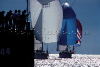 Spectators watch Swans racing from the deck of a US Coastguard support ship