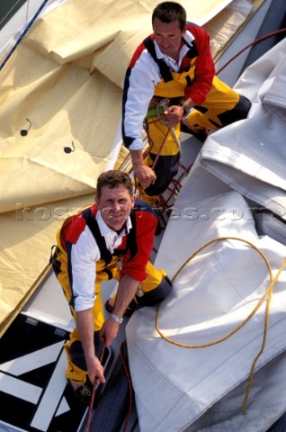 Aerial view of two crew members pulling on a line