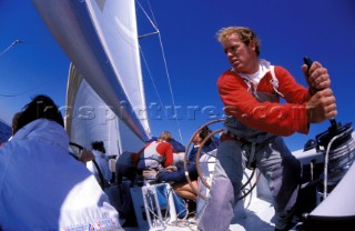 Crew member grinding a winch