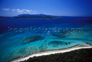 Small collection of yachts anchored off beach in shallow water, St Martin, Caribbean