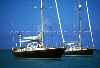 Two yachts moored in shallow water off the Caribbean island of St Martin