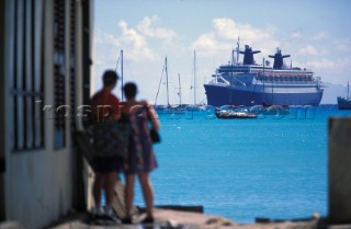 Cruise Liners, Philipsburg, St Maarten, 1999 A couple stand on a dock looking at a cruise ship in the harbour