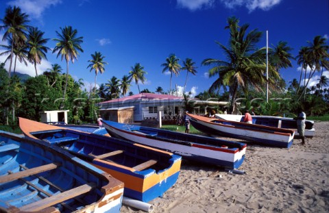 Small fishing boats on sandy beach  Nevis Caribbean