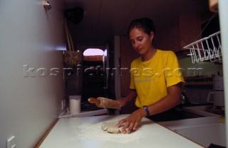 Cook onboard a yacht prepares a meal for charter guests