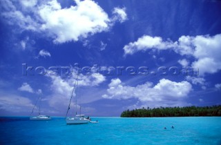 Two yachts at anchor in Tahiti - Polynesia