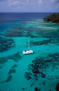 Aerial view of catamaran anchored in the Seychelles