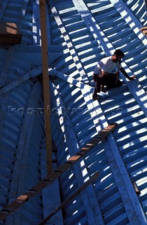 Boat builder constructing wooden boat - Turkey