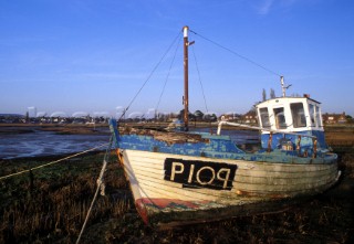 Front view of beached fishing boat, Bosham harbour, UK