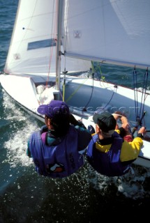 Two crew hiking out on a 470 dinghy