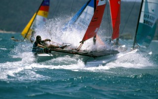 Hobie Cat powers through a wave