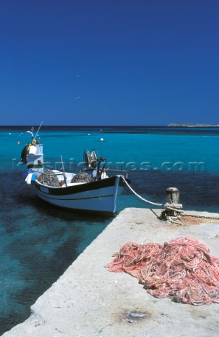 Fishing boat tied to dockside