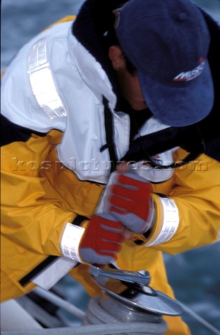 Close up of man grinding winch