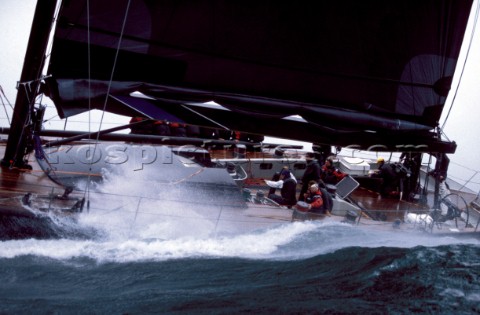 Spray over deck of sailing yacht in rough seas
