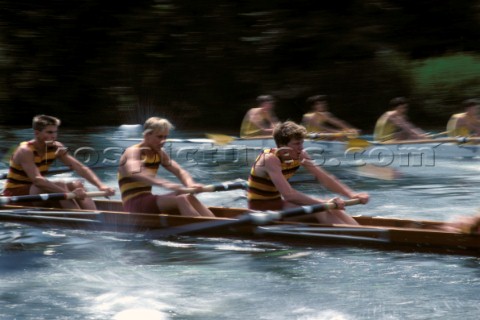 Two rowing fours race at Royal Henley Regatta on the river Thames UK