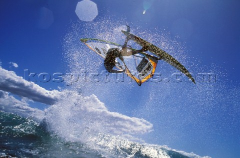 A windsurfer gets big air off a wave