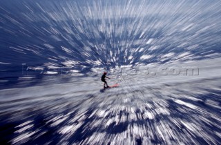 Zoom burst effect on aerial view of waterskier