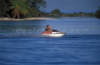 Mother and daughter enjoy a jet ski ride together