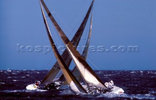 Two Americas Cup class yachts cross tacking in a match race