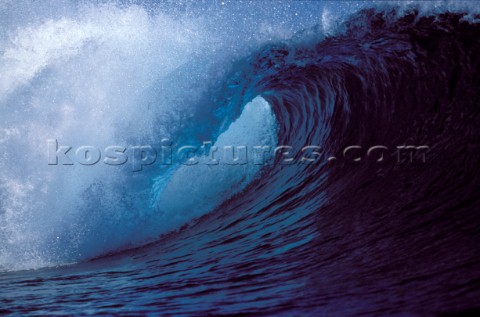 Crest of a huge breaking surf wave