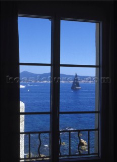 View through window of yacht sailing in harbour