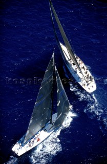 Two Americas Cup yachts dialling up at the start of a match race