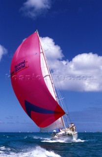 Yacht sailing under spinnaker