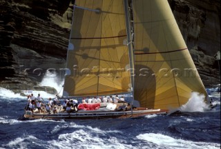 Swan racing close inshore during Antigua Sailing Week