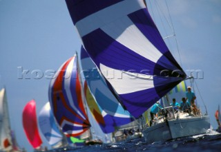 Colourful spinnakers of fleet racing at Antigua Sailing Week