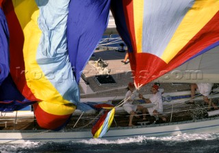 Crew hauling in a spinnaker, Antigua Race Week