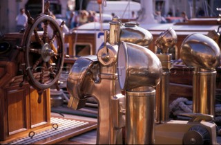 Brass dorades and wheel on a classic yacht