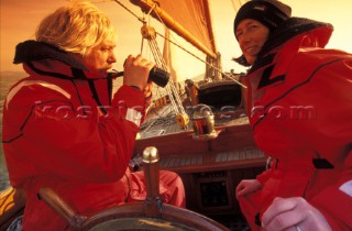 Couple on morning watch in red foul weather gear