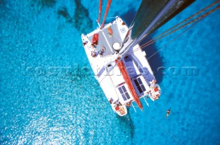 Charter catamaran in Akans Key Anchorage in the Bahamas.