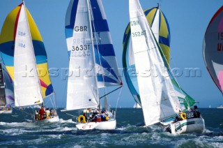 Fleet racing down wind under spinnaker