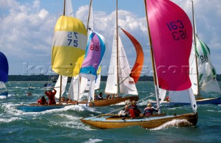 Fleet of X Boats racing down wind during Cowes Week, Isle of Wight