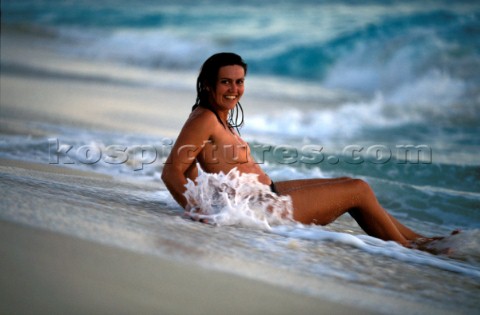 Topless model girl on a cruising charter holiday