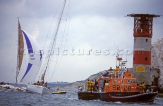 Seastart and the Yarmouth Arun 52 RNLI lifboat standing by as the Beneteau Spirit of the North crashes into Goose Rock whilst under spinnaker, alongside the maxi Longobarda which is already aground next to the Needles lighthouse