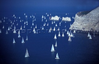 Aerial view of fleet of yachts competing in the Round the Island Race in the Solent, UK