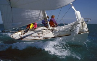 J24 racing in choppy water during the 24 Worlds in Poole, Dorset, UK