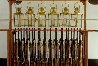 Guns and lanterns on board the tall ship Vespucci