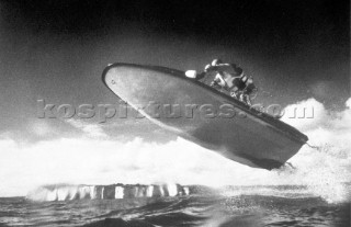 Jet Skier in mid jump after taking off from a wave