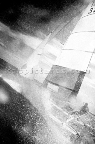 High action shot of two dinghy sailors racing in strong winds