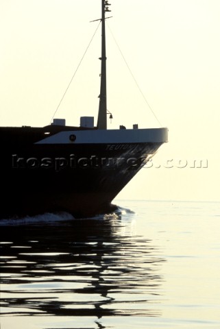 Bow of ship reflected in water