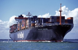 Loaded cargo ship under way across the Solent