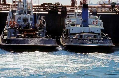 Two tugs manoevre an oil tanker