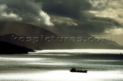 Commercial Ship in Sunset Seascape