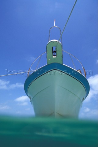 Profile of moored motor boat from surface of the water